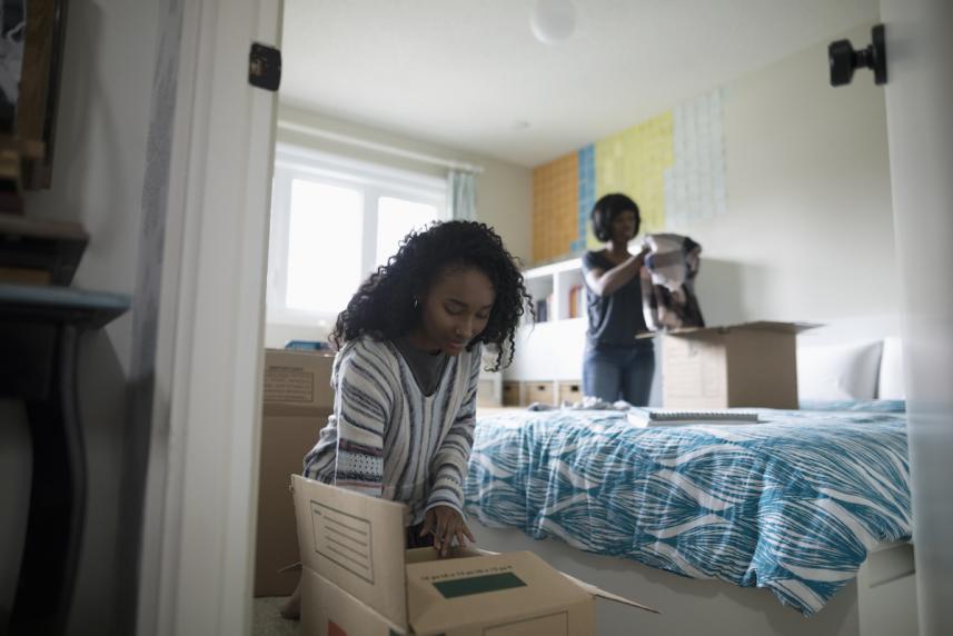 Woman cleaning up a room