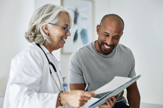 Man reviewing treatment plan with his doctor